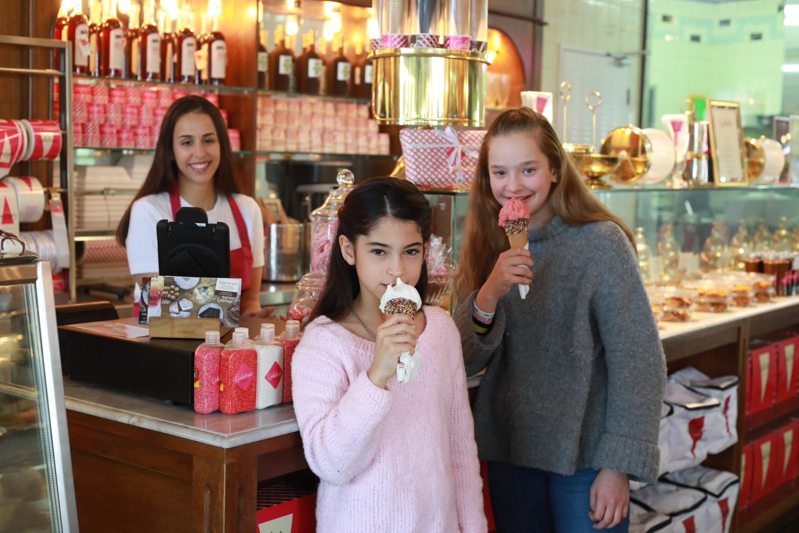 Customers enjoying ice cream at a shop counter